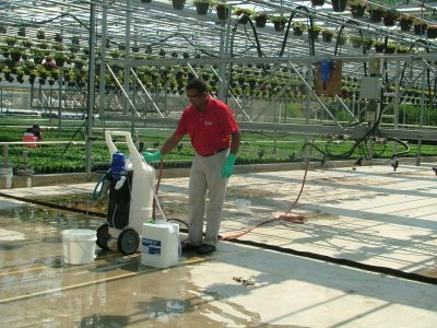 Dr. Vijay Choppakatla doing product demos in CT greenhouse.